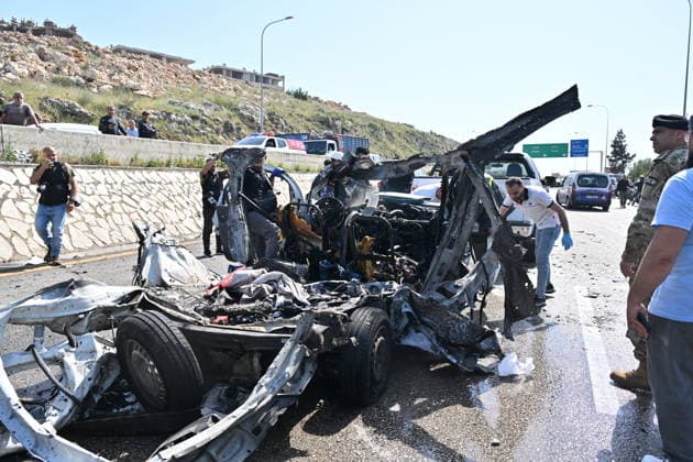 Israeli airstrike targets vehicle on Beirut-Sidon Highway in Lebanon BEIRUT, LEBANON - MAY 09: Lebanese security forces and emergency teams work at the scene after an Israeli air strike targeted a moving vehicle on the Beirut-Sidon highway on May 09, 2026. Reports indicate that two people lost their lives and two others sustained injuries in the attack. The targeted vehicle remains completely destroyed as security personnel cordons off the area following the strike. Houssam Shbaro Anadolu Beirut Lebanon. Editorial use only. Please get in touch for any other usage.  Copyright: x2026xAnadoluxHoussamxShbarox