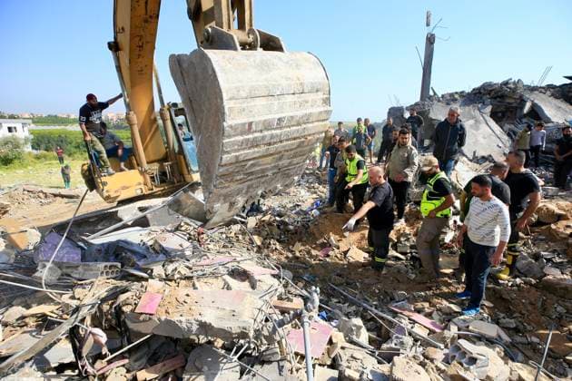 (260510) -- SAKSAKIYEH, May 10, 2026 -- Rescuers search for victims amid the rubble of a residential building after Israeli airstrikes in Saksakiyeh, south Lebanon, May 9, 2026. At least 15 people were killed in a series of Israeli airstrikes in southern Lebanon on Saturday, according to Lebanese official sources. At least one child was among those killed and several children were among those injured in the strikes, according to the Lebanese Health Ministry and the National News Agency. (Photo by Xinhua) LEBANON-SAKSAKIYEH-ISRAELI AIRSTRIKE-AFTERMATH AlixHashisho 