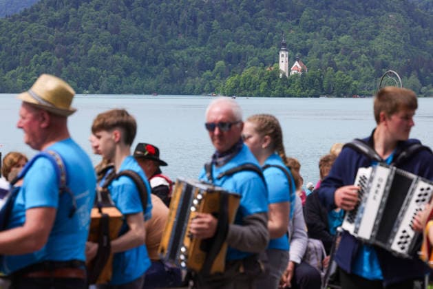 (260510) -- BLED, May 10, 2026 -- Participants are pictured during the accordion weekend event at Lake Bled in Bled, Slovenia, May 10, 2026. This annual event brings together hundreds of participants for band performances, ensemble shows and an accordion procession. (Photo by Xinhua) SLOVENIA-BLED-ACCORDION WEEKEND ZeljkoxStevanic 