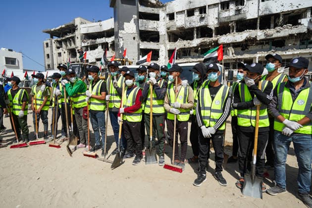 Volunteers clear rubble at al-Shifa Hospital in Gaza City Palestinian volunteers take part in removing rubble and cleaning the outer courtyard of al-Shifa Hospital in Gaza City on May 10, 2026, as part of the Volunteer Work Week activities organized by the Operation Chivalrous Knight 3 initiative. The campaign included cleaning works, rubble removal, tree planting and the installation of shade structures for residents around the hospital. Photo by Ramzi Abu Amer apaimages Khan Yunis Gaza Strip Palestinian Territory 100526_Gaza_RA_00(7).jpeg Copyright: xapaimagesxRamzixxAbuxAmerx xapaimagesx