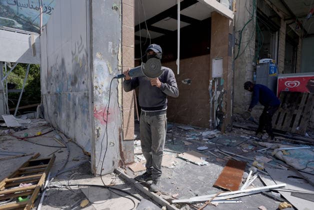 Palestinian shop owners face demolition orders in east Jerusalem JERUSALEM - MAY 10: Palestinian shop owners demolish their own businesses after Israeli authorities issued demolition and evacuation orders for commercial structures in the Al-Mushtal area of Al-Eizariya in East Jerusalem, on May 10, 2026. According to the Jerusalem Governorate, around 50 Palestinian-owned shops and commercial facilities were targeted, while Israeli security forces were deployed in the area. Issam Rimawi Anadolu Jerusalem Israel. Editorial use only. Please get in touch for any other usage.  Copyright: x2026xAnadoluxIssamxRimawix