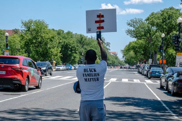 May 10, 2026, Washington, Dc, USA: A man walks ahead of the Black Mothers March in Washington, DC on the street. Dozens of protesters gathered at the Lincoln Memorial on MotherÃ¢â‚¬â ¢s Day to demand greater protections for Black mothers and families. Washington USA  - ZUMAh204 20260510_znp_h204_009 Copyright: xRileyxHartyx