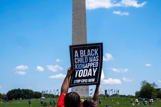 May 10, 2026, Washington, Dc, USA: A protester holds a sign in front of the Washington Monument on MotherÃ¢â‚¬â ¢s Day as part of the Black Mothers March. Dozens gathered at the Lincoln Memorial for the rally to demand greater protections for Black mothers and families. Washington USA - ZUMAh204 20260510_znp_h204_012 Copyright: xRileyxHartyx