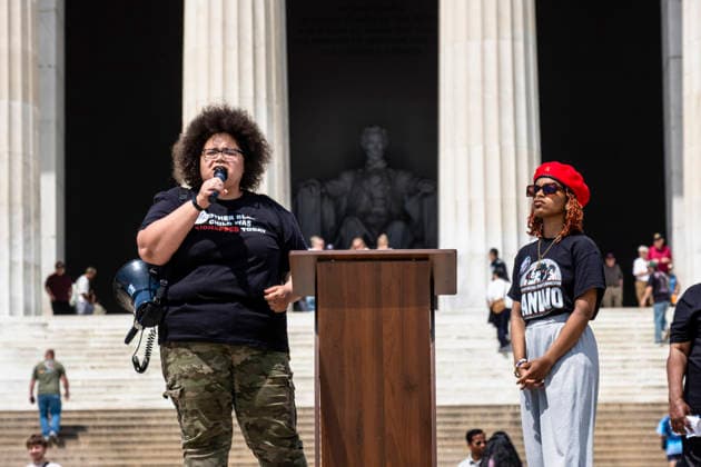 May 10, 2026, Washington, Dc, USA: RAGE GRAY and MARYAM MUHAMMAD speak to a crowd of protesters gathered for the Black Mothers March in front of the Lincoln Memorial. The rally took place on MotherÃ¢â‚¬â ¢s Day to demand greater protections for Black mothers and families. Washington USA - ZUMAh204 20260510_znp_h204_016 Copyright: xRileyxHartyx