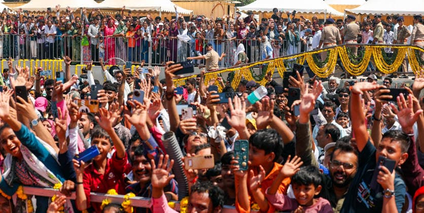 People wave and click pictures during a roadshow by Prime Minister Narendra Modi (unseen) on the occasion of Somnath Amrut Mahotsav Gir Somnath, May 11 (ANI): People wave and click pictures during a roadshow by Prime Minister Narendra Modi (unseen) on the occasion of Somnath Amrut Mahotsav, celebrating 75 years of the inauguration of the restored Somnath temple, in Gir Somnath on Monday. (DPR PMO ANI Photo) Gir Somnath Gujarat India Copyright: xANIx ANI_20260511113