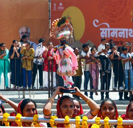 A woman holds an idol of Lord Krishna during a roadshow by Prime Minister Narendra Modi Gir Somnath, May 11 (ANI): A woman holds an idol of Lord Krishna during a roadshow by Prime Minister Narendra Modi (unseen) on the occasion of Somnath Amrut Mahotsav, celebrating 75 years of the inauguration of the restored Somnath temple, in Gir Somnath on Monday. (DPR PMO ANI Photo) Gir Somnath Gujarat India Copyright: xANIx ANI_20260511114