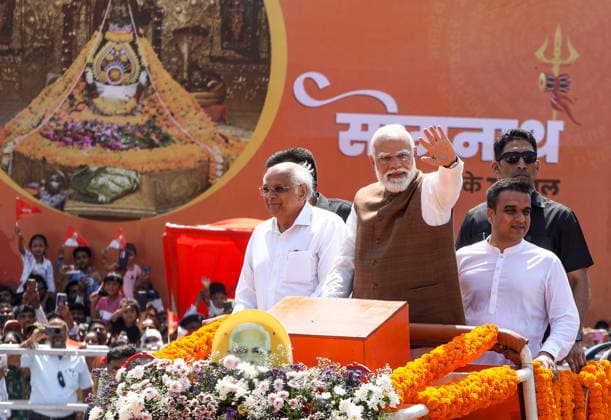 Prime Minister Narendra Modi waves to the crowd during a roadshow on the occasion of Somnath Amrut Mahotsav Gir Somnath, May 11 (ANI): Prime Minister Narendra Modi waves to the crowd during a roadshow on the occasion of Somnath Amrut Mahotsav, celebrating 75 years of the inauguration of the restored Somnath temple, in Gir Somnath on Monday. Gujarat Chief Minister Bhupendra Patel and Deputy Chief Minister Harsh Sanghavi also present. Gir Somnath Gujarat India Copyright: xANIx ANI_20260511183