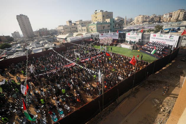 50 couples got married in a mass wedding ceremony in Gaza GAZA CITY, GAZA, PALESTINE - MAY 11: A view of the wedding ceremony as 50 Palestinian couples get married as part of aid efforts to the Gaza Strip organized by the Humanitarian Relief Foundation (IHH) and attended by hundreds of people in Gaza City, Gaza, Palestine, on May 11, 2026. Abdalhkem Abu Riash Anadolu Gaza City Gaza. Editorial use only. Please get in touch for any other usage.  Copyright: x2026xAnadoluxAbdalhkemxAbuxRiashx