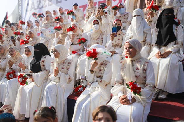 Mass Wedding Gaza City May 11 Brides holding bouquets sit on the steps of a stage during a mass wedding celebration in Gaza City, Gaza Strip, on May 11, 2026. The mass wedding celebration for 50 grooms, identified by organizers as orphans of conflict casualties, is sponsored by the Turkish Humanitarian Relief Foundation (IHH). Gaza Gaza Strip Palestinian Territories Copyright: xAhmedxAlxArinix