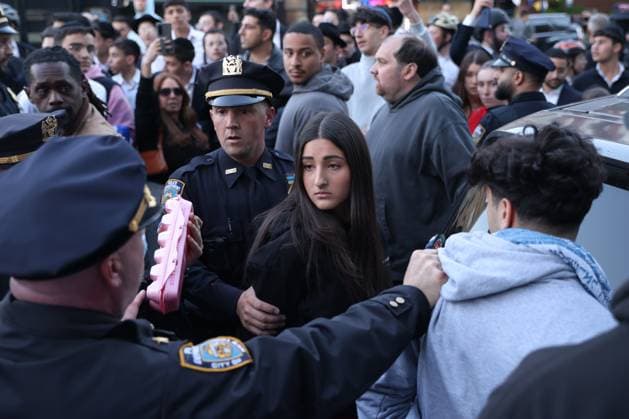 Rally against Israeli real state event in Brooklyn NEW YORK, UNITED STATES – May 11: NYPD officers arrest a counter protestor for throwing eggs at a Pro-Palestinian rally during a protest against an Israeli real state event at Young Israel Synagogue of Midwood, Brooklyn, U.S., May 11, 2026. Mostafa Bassim Anadolu New York United States. Editorial use only. Please get in touch for any other usage.  Copyright: x2026xAnadoluxMostafaxBassimx