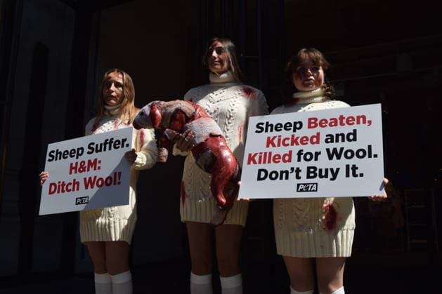 May 12, 2026, London, England, United Kingdom: PETA activists with fake bruises and blood hold a fake dead lamb during a protest outside H&M on Regent Street, calling on the fashion group to stop selling wool. London United Kingdom  - ZUMAv130 20260512_zip_v130_001 Copyright: xVukxValcicx