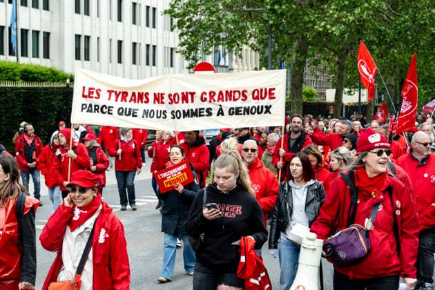 May 12, 2026, Brussels, Brussels, Belgium: For the sixth time since 2025, the three major labour unions have managed to rally their members for a national strike and demonstration. Together with various organisations from different sectors, they have brought 50,000 people onto the streets of Brussels today..The protesters are angry about the reforms of Bart De Weverâ€⠢s federal government. Minister Jan Jambonâ€⠢s pension plans, in particular, are causing a great deal of anger. Various protesters spoke to us: â€oeWe feel robbed.â€Â..The demonstration also passed the American Embassy, where a striking number of people voiced their dissatisfaction with Trump and the US Ambassador to Belgium. ..The offices of the French-speakin - ZUMAr234 20260512_zip_r234_009 Copyright: xBobxReijndersx
