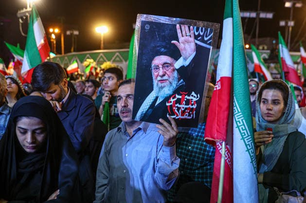 May 12, 2026, Tehran, Iran: A Pro-government supporter holds a picture of the late Supreme Leader Ayatollah Ali Khamenei during a state-organized rally, amid a ceasefire in the conflict involving Iran, the United States, and Israel. The United States and Israel launched strikes against Iran on February 28, killing IranÃ¢â‚¬â ¢s supreme leader and top military leaders, prompting Iranian authorities to retaliate with strikes on Israel and across the Gulf, while U.S. President Donald Trump recently described the ceasefire agreement with Iran as being in a Ã¢â‚¬oevery weakÃ¢â‚¬Â state and the spokesman for the Iranian parliamentÃ¢â‚¬â ¢s national security commission warned the United States on May 10 against any attacks on vessels in Gulf wate - ZUMAi98_ 20260512_zih_i98_013 Copyright: xIranianxSupremexLeader SxOfficex