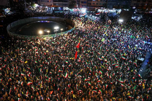 May 12, 2026, Tehran, Iran: Pro-government supporters wave national flags during a state-organized rally, amid a ceasefire in the conflict involving Iran, the United States, and Israel. The United States and Israel launched strikes against Iran on February 28, killing Iranâ€⠢s supreme leader and top military leaders, prompting Iranian authorities to retaliate with strikes on Israel and across the Gulf, while U.S. President Donald Trump recently described the ceasefire agreement with Iran as being in a â€oevery weak†state and the spokesman for the Iranian parliamentâ€⠢s national security commission warned the United States on May 10 against any attacks on vessels in Gulf waters, saying Iranâ€⠢s restraint was over. T - ZUMAi98_ 20260512_zih_i98_016 Copyright: xIranianxSupremexLeader SxOfficex