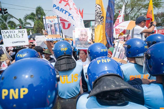 May 13, 2026, Pasay, Metro Manila, Philippines: Protesters stand in front of riot police as they approach the gates of the Philippine Senate. Pasay Philippines - ZUMAy102 20260513_zip_y102_004 Copyright: xKenosisxYapx