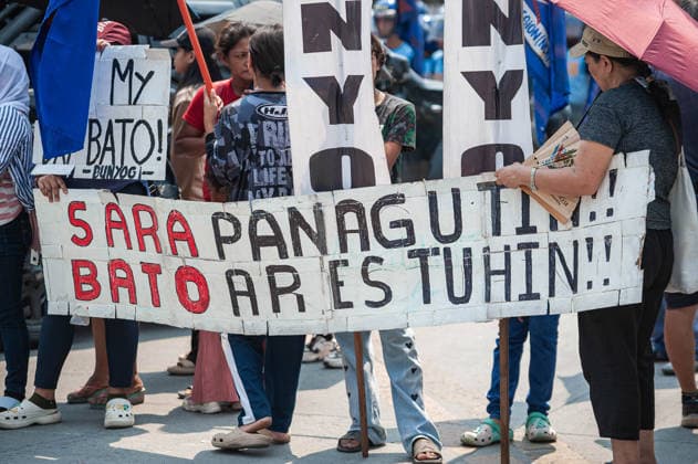 May 13, 2026, Pasay, Metro Manila, Philippines: A banner is held calling for the arrest of the Senator and impeachment of the Vice President. Pasay Philippines - ZUMAy102 20260513_zip_y102_007 Copyright: xKenosisxYapx