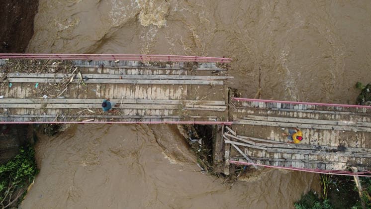 Aftermath of flood in Sumatra TANAH DATAR, INDONESIA - MAY 13: An aerial view of the destruction of bridge among the wooden debris affected by floods in Tanah Datar, West Sumatera Province, Indonesia on May 13, 2026. The structures affected by the floods include residential homes, vehicle, irrigation dam, two village bridge, subdistrict roads, and the rice field. Adi Prima Anadolu Tanah Datar Indonesia. Editorial use only. Please get in touch for any other usage.  Copyright: x2026xAnadoluxAdixPrimax