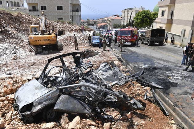 Israeli military carried out a drone strike in Beirut despite ceasefire BEIRUT, LEABANON - MAY 13: A view of burnt car after an Israeli drone strike in Saadiyat, south of Beirut, Lebanon on May 13, 2026. Despite a ceasefire, the Israeli military targeted a total of seven vehicles across different areas of Lebanon since the early hours of the morning using unmanned aerial vehicles (UAVs). In Saadiyat, one of the targeted vehicles was set ablaze and became completely unusable. Firefighters and soldiers arrived at the scene, carried out inspections, and secured the surrounding area. Houssam Shbaro Anadolu Beirut Lebanon. Editorial use only. Please get in touch for any other usage.  Copyright: x2026xAnadoluxHoussamxShbarox