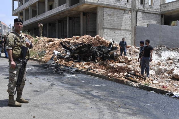 Israeli military carried out a drone strike in Beirut despite ceasefire BEIRUT, LEABANON - MAY 13: A view of burnt car after an Israeli drone strike in Saadiyat, south of Beirut, Lebanon on May 13, 2026. Despite a ceasefire, the Israeli military targeted a total of seven vehicles across different areas of Lebanon since the early hours of the morning using unmanned aerial vehicles (UAVs). In Saadiyat, one of the targeted vehicles was set ablaze and became completely unusable. Firefighters and soldiers arrived at the scene, carried out inspections, and secured the surrounding area. Houssam Shbaro Anadolu Beirut Lebanon. Editorial use only. Please get in touch for any other usage.  Copyright: x2026xAnadoluxHoussamxShbarox