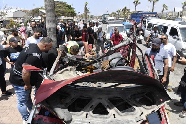 Israeli drone attack target vehicles in Lebanon despite ceasefire SIDON, LEBANON - MAY 13: People inspect the wreckage of a vehicle targeted by an Israeli drone in the city of Sidon, Lebanon on May 13, 2026. Despite a temporary ceasefire brokered on April 17 and recently extended by the United States, the Israeli military intensified its aerial activity, targeting a total of seven vehicles with drone strikes across various Lebanese regions since the early morning hours. Houssam Shbaro Anadolu Sidon Lebanon. Editorial use only. Please get in touch for any other usage.  Copyright: x2026xAnadoluxHoussamxShbarox