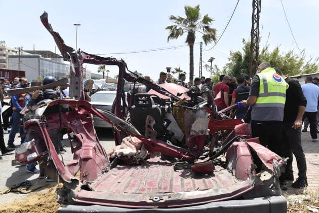 Israeli drone attack target vehicles in Lebanon despite ceasefire SIDON, LEBANON - MAY 13: People inspect the wreckage of a vehicle targeted by an Israeli drone in the city of Sidon, Lebanon on May 13, 2026. Despite a temporary ceasefire brokered on April 17 and recently extended by the United States, the Israeli military intensified its aerial activity, targeting a total of seven vehicles with drone strikes across various Lebanese regions since the early morning hours. Houssam Shbaro Anadolu Sidon Lebanon. Editorial use only. Please get in touch for any other usage.  Copyright: x2026xAnadoluxHoussamxShbarox
