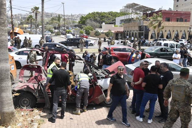 Israeli drone attack target vehicles in Lebanon despite ceasefire SIDON, LEBANON - MAY 13: People inspect the wreckage of a vehicle targeted by an Israeli drone in the city of Sidon, Lebanon on May 13, 2026. Despite a temporary ceasefire brokered on April 17 and recently extended by the United States, the Israeli military intensified its aerial activity, targeting a total of seven vehicles with drone strikes across various Lebanese regions since the early morning hours. Houssam Shbaro Anadolu Sidon Lebanon. Editorial use only. Please get in touch for any other usage.  Copyright: x2026xAnadoluxHoussamxShbarox