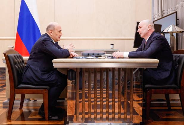 RUSSIA, MOSCOW - MAY 13, 2026: Russia’s Prime Minister Mikhail Mishustin (L) and the head of Russia s Federal Service for Supervision in Education and Science, Anzor Musayev talk during a meeting at the House of the Russian Government. Dmitry Astakhov POOL TASS  92398115