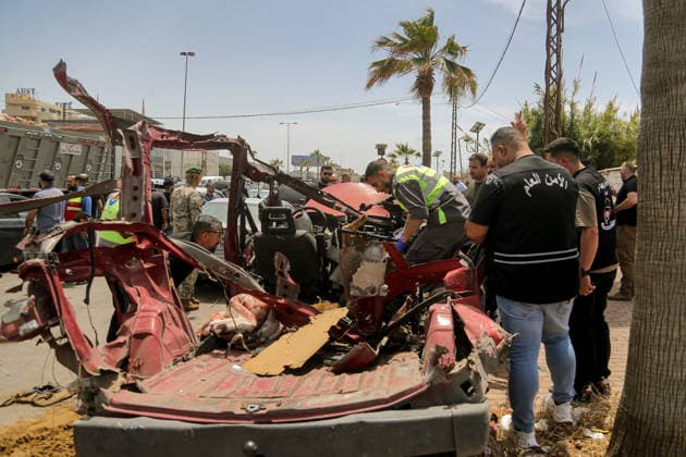 May 13, 2026, Sidon, Sidon, Lebanon: A civil defense member inspects wreckage of a vehicle that was targeted in an Israeli drone at the entrance of the southern port city of Sidon. Israel has kept up its airstrikes against the Iran-backed militant group Hezbollah despite a truce in place since April 17 aimed at halting the fighting. The violence comes with Lebanon and Israel due to hold a new round of direct negotiations in Washington on Thursday, brokered by the United States. Sidon Lebanon - ZUMAn313 20260513_zip_n313_004 Copyright: xMarwanxNaamanix