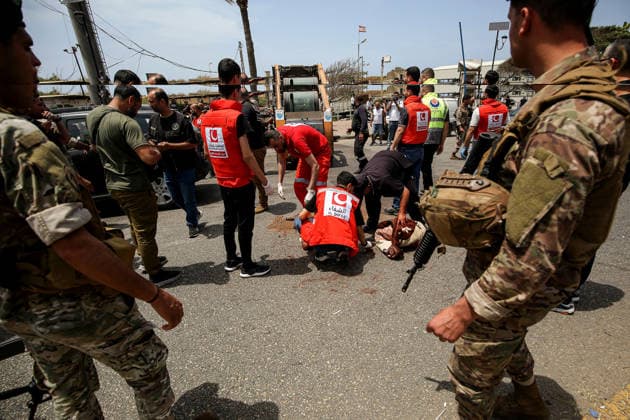 May 13, 2026, Sidon, Sidon, Lebanon: Lebanese soldiers secure the area as civil defense members collect remain of human body after an Israeli drone struck a vehicle at the entrance of the southern port city of Sidon. Israel has kept up its airstrikes against the Iran-backed militant group Hezbollah despite a truce in place since April 17 aimed at halting the fighting. The violence comes with Lebanon and Israel due to hold a new round of direct negotiations in Washington on Thursday, brokered by the United States. Sidon Lebanon - ZUMAn313 20260513_zip_n313_002 Copyright: xMarwanxNaamanix