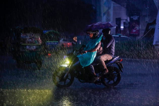 May 13, 2026, Dhaka, Bangladesh: People struggle through heavy rain on a street in Dhaka, Bangladesh, on May 13, 2026, as dark clouds and intense downpours swept across the capital and several parts of the country. Dhaka Bangladesh - ZUMAh355 20260513_zip_h355_044 Copyright: xMd.xRakibulxHasanxRafiux