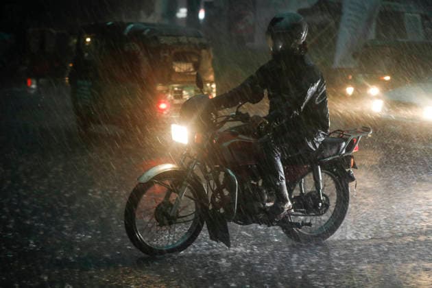 May 13, 2026, Dhaka, Bangladesh: People struggle through heavy rain on a street in Dhaka, Bangladesh, on May 13, 2026, as dark clouds and intense downpours swept across the capital and several parts of the country. Dhaka Bangladesh - ZUMAh355 20260513_zip_h355_046 Copyright: xMd.xRakibulxHasanxRafiux