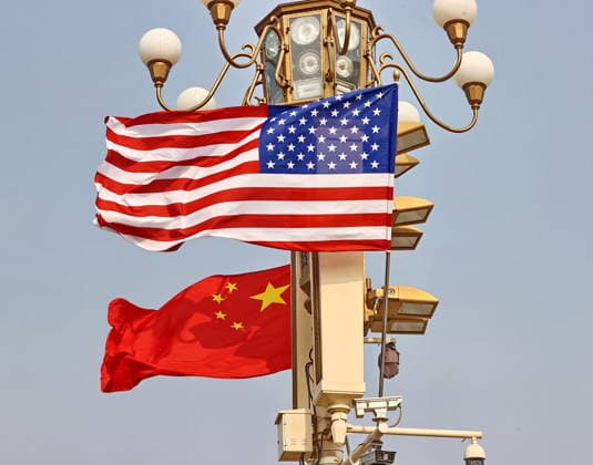 BEIJING, CHINA - MAY 13: National flags of China and the U.S. hang from lamp posts on the Tiananmen Square on May 13, 2026 in Beijing, China. At the invitation of Chinese President Xi Jinping, Trump is visiting China from May 13 to 15.  Copyright: xVCGx 111641168808
