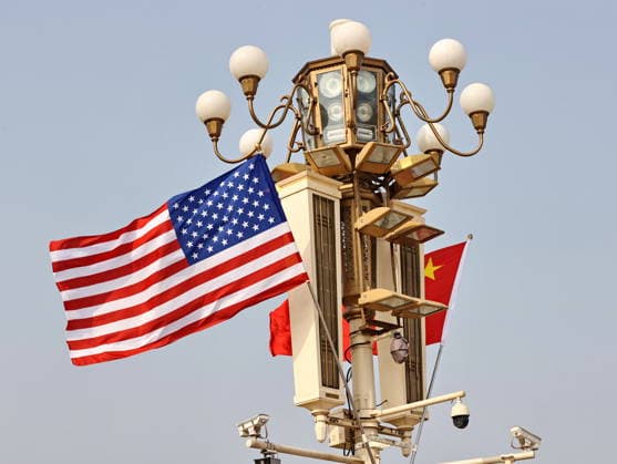 BEIJING, CHINA - MAY 13: National flags of China and the U.S. hang from lamp posts on the Tiananmen Square on May 13, 2026 in Beijing, China. At the invitation of Chinese President Xi Jinping, Trump is visiting China from May 13 to 15.  Copyright: xVCGx 111641168805