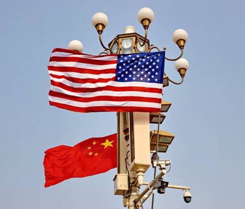 BEIJING, CHINA - MAY 13: National flags of China and the U.S. hang from lamp posts on the Tiananmen Square on May 13, 2026 in Beijing, China. At the invitation of Chinese President Xi Jinping, Trump is visiting China from May 13 to 15.  Copyright: xVCGx 111641168809