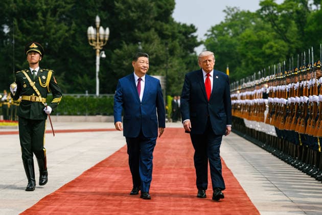 May 14, 2026, Beijing, China: Chinese President Xi Jinping, left, escorts U.S. President Donald Trump, for a review of the honor guard during the official welcoming ceremony at the Great Hall of the People, May 14, 2026 in Beijing, China. Beijing China - ZUMAp138 20260514_zaa_p138_034 Copyright: xHandout WhitexHousex
