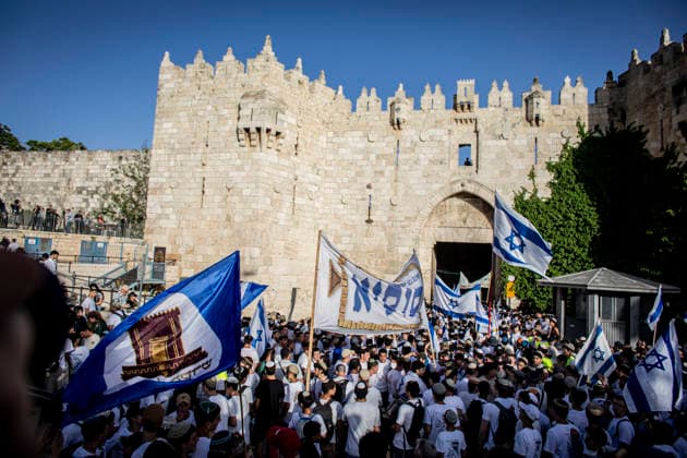 Jerusalem Day Flag Parade Israeli right wing youths wave their national flags outside Damascus gate In Jerusalem, Thursday May 14 2026. Israeli nationalists, many of them teenagers and young adults, swept through the narrow streets of Jerusalem™s Old City on Thursday during the annual Jerusalem Day march, chanting Death to Arabs and May your villages burn as tens of thousands paraded to celebrate what Israeli authorities call the reunification of Jerusalem following Israel™s capture and annexation of east Jerusalem in the 1967 Arab-Israeli war, while many Palestinian residents remained barricaded indoors and shopkeepers were forced, ostensibly for their own protection, to close their businesses. Photo by Eyal Warshavsk Copyright: xEyalxWarshavskyx