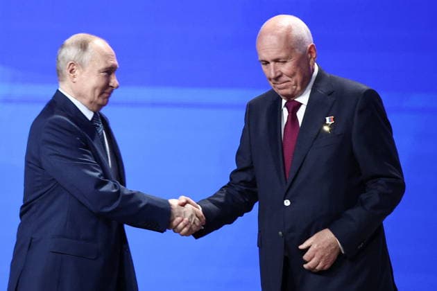 RUSSIA, MOSCOW - MAY 14, 2026: Russia s President Vladimir Putin (L) and Rostec CEO Sergei Chemezov attend the 10th Congress of the Russian Engineering Union at the Russia National Centre. Mikhail Tereshchenko TASS  92459943