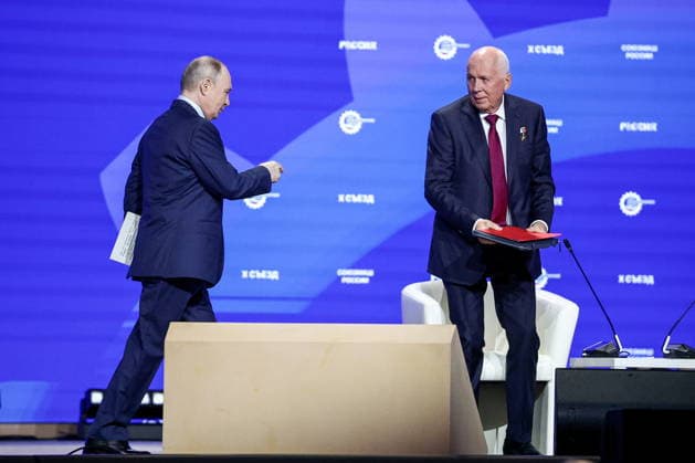 RUSSIA, MOSCOW - MAY 14, 2026: Russia s President Vladimir Putin (L) and Rostec CEO Sergei Chemezov attend the 10th Congress of the Russian Engineering Union at the Russia National Centre. Mikhail Tereshchenko TASS  92459947