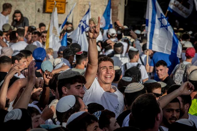 Jerusalem Day Flag Parade Israeli right wing youth points his finger up outside Damascus gate In Jerusalem, Thursday May 14 2026. Israeli nationalists, many of them teenagers and young adults, swept through the narrow streets of JerusalemÕs Old City on Thursday during the annual Jerusalem Day march, chanting ÒDeath to ArabsÓ and ÒMay your villages burnÓ as tens of thousands paraded to celebrate what Israeli authorities call the ÒreunificationÓ of Jerusalem following IsraelÕs capture and annexation of east Jerusalem in the 1967 Arab-Israeli war, while many Palestinian residents remained barricaded indoors and shopkeepers were forced, ostensibly for their own protection, to close their businesses. Photo by Eyal Warshavsky. Jerusalem Israel Copyright: xEyalxWarshavskyx