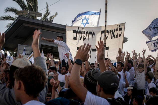 Jerusalem Day Flag Parade Israeli right wing youths wave their national flag and chant outside Damascus gate In Jerusalem, Thursday May 14 2026. Israeli nationalists, many of them teenagers and young adults, swept through the narrow streets of JerusalemÕs Old City on Thursday during the annual Jerusalem Day march, chanting ÒDeath to ArabsÓ and ÒMay your villages burnÓ as tens of thousands paraded to celebrate what Israeli authorities call the ÒreunificationÓ of Jerusalem following IsraelÕs capture and annexation of east Jerusalem in the 1967 Arab-Israeli war, while many Palestinian residents remained barricaded indoors and shopkeepers were forced, ostensibly for their own protection, to close their businesses. Photo by Eyal Warshavsky. Jeru Copyright: xEyalxWarshavskyx