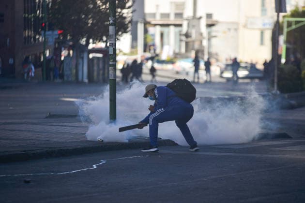 Miners attempt to break through police cordon in La Paz LA PAZ, BOLIVIA - MAY 14: A protester pushes aside a tear gas canister fired by police during clashes with miners demanding fuel supplies, access to explosives and improved mining conditions in downtown La Paz, Bolivia, on May 14, 2026. Carlos Sanchez Navas Anadolu La Paz Bolivia. Editorial use only. Please get in touch for any other usage.  Copyright: x2026xAnadoluxCarlosxSanchezxNavasx