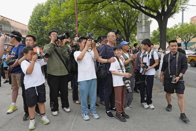 U.S. President Trump departs Beijing People gather to watch Air Force One carrying U.S. President Donald Trump take off from an airport in Beijing on May 15, 2026, following his state visit to China for a summit with Chinese President Xi Jinping.  A14AA0005560743P