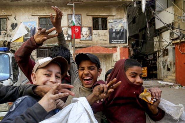 May 15, 2026, Beirut, Beirut, Lebanon: Palestinian garbage collectors youth gesture as they head to work inside the Palestinian refugee camp of Shatila in Beirut. Palestinian refugees in Lebanon marked the 78th anniversary of the Nakba Ã¢â‚¬ Arabic for Ã¢â‚¬oecatastropheÃ¢â‚¬Â Ã¢â‚¬ a term that refers to displacement and dispossession of approximately 750,000 Palestinians during the creation of Israel. Palestinian refugees in Lebanon face dire challenges by the ongoing regional instability and the lack of a clear resolution to their displacement. Beirut Lebanon - ZUMAn313 20260515_zip_n313_010 Copyright: xMarwanxNaamanix