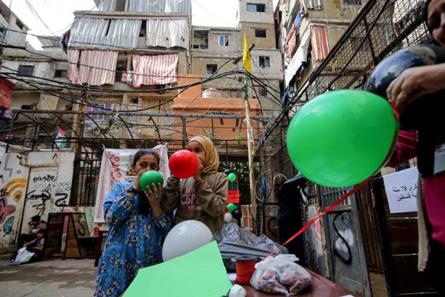 May 15, 2026, Beirut, Beirut, Lebanon: Palestinian girls blow red, green, white and black balloons, the color of the Palestinian flag during a ceremony to mark the 78th anniversary of the Nakba Ã¢â‚¬ Arabic for Ã¢â‚¬oecatastropheÃ¢â‚¬Â Ã¢â‚¬ a term that refers to displacement and dispossession of approximately 750,000 Palestinians during the creation of Israel --, at the Palestinian refugee camp of Shatila in Beirut. FridayÃ¢â‚¬â ¢s anniversary is the third Nakba commemoration since IsraelÃ¢â‚¬â ¢s war on Gaza began. Beirut Lebanon  - ZUMAn313 20260515_zip_n313_014 Copyright: xMarwanxNaamanix