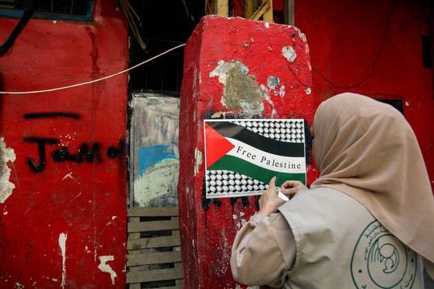 May 15, 2026, Beirut, Beirut, Lebanon: A Palestinian activist hangs a placard displaying the Palestinian flag with the slogan Ã¢â‚¬ËœÃ¢â‚¬â ¢Free PalestineÃ¢â‚¬â ¢Ã¢â‚¬â ¢ during a ceremony to mark the 78th anniversary of the Nakba Ã¢â‚¬ Arabic for Ã¢â‚¬oecatastropheÃ¢â‚¬Â Ã¢â‚¬ a term that refers to displacement and dispossession of approximately 750,000 Palestinians during the creation of Israel, at the Palestinian refugee camp of Shatila in Beirut. FridayÃ¢â‚¬â ¢s anniversary is the third Nakba commemoration since IsraelÃ¢â‚¬â ¢s war on Gaza began. Beirut Lebanon  - ZUMAn313 20260515_zip_n313_002 Copyright: xMarwanxNaamanix