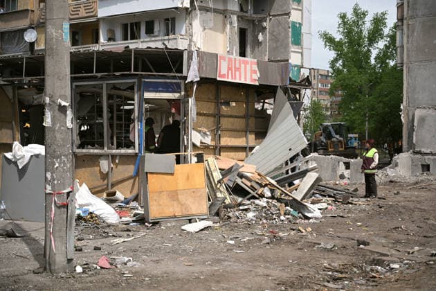 A plumbing shop is outside a nine-storey apartment block in the Darnytskyi district, where a Russian missile destroyed a section, Kyiv, Ukraine, May 15, 2026. The residential building was struck by a Russian missile, allegedly a Kh-101, at around 3:00 a.m. local time on 14 May. The missile detonated inside the building, causing an entire section to collapse, killing 24 people, including three children, and injuring 48 others. The search and rescue operation lasted more than 28 hours, during which the State Emergency Service rescued 30 residents. (Photo by Yevhen Kotenko Ukrinform) Foreign diplomats visit Kyiv apartment block hit by Russian missile Copyright: xEVGEN_KOTENKOx