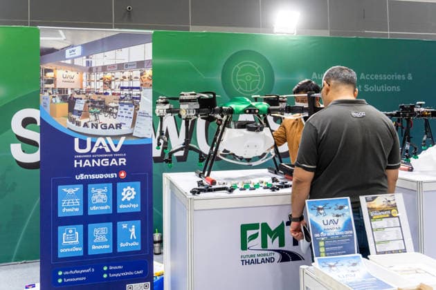 May 15, 2026, Bangkok, Thailand: General view of a booth displaying a large agricultural multi-rotor drone on a table, with a visitor and an exhibitor, during Future Mobility Thailand 2026 at BITEC. Future Mobility Thailand 2026 is a trade show showcasing the latest automotive and mobility technologies, connecting manufacturers, distributors, and buyers. Bangkok Thailand  - ZUMAs197 20260515_aaa_s197_572 Copyright: xNathaliexJamoisx