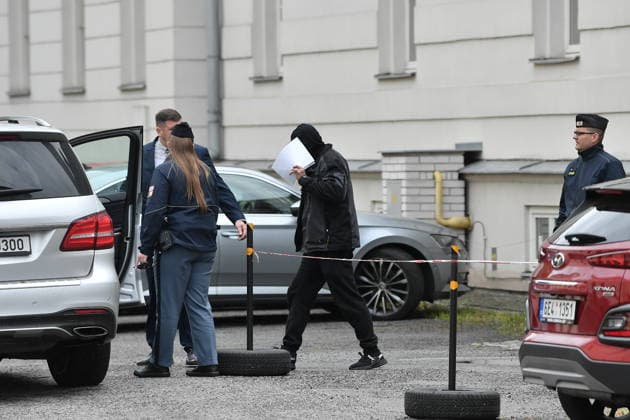 A man (middle) suspected of stealing a precious relic, the skull of Saint Zdislava of Lemberk, walks with his lawyer (left) away from the district court that did not send him into custody, in Ceska Lipa, Czech Republic, on May 16, 2026. (CTKxPhoto VitxCerny) CTKPhotoP2026051602525  CTKPhotoP2026051602525