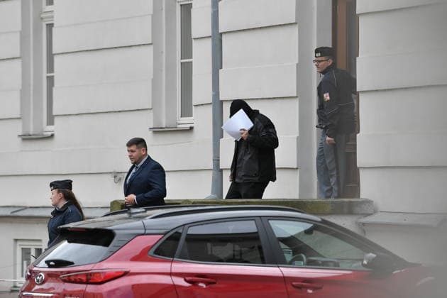 A man (3rd from left) suspected of stealing a precious relic, the skull of Saint Zdislava of Lemberk, walks with his lawyer Vit Pavko (2nd from left) away from the district court that did not send him into custody, in Ceska Lipa, Czech Republic, on May 16, 2026. (CTKxPhoto VitxCerny) CTKPhotoP2026051602528  CTKPhotoP2026051602528