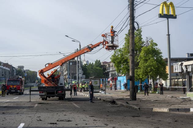 Aftermath of a Russian UAV strike on Kharkiv KHARKIV, UKRAINE - MAY 16: A view of the damage in the area after a Russian UAV strike on a avenue in central Kharkiv, Ukraine on May 16, 2026. The drone struck the road. Three subway exits, three public transportation stops, the trolleybus overhead wire system, and a trolleybus near a stop were damaged. One person was injured. Explosive ordnance disposal experts are on the scene, and municipal workers are clearing up the aftermath of the explosion. Serhii Masin Anadolu Kharkiv Ukraine. Editorial use only. Please get in touch for any other usage.  Copyright: x2026xAnadoluxSerhiixMasinx
